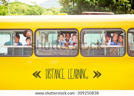 The word distance learning against cute pupils smiling at camera in the school bus