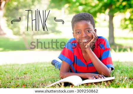 The word think against little boy reading in the park