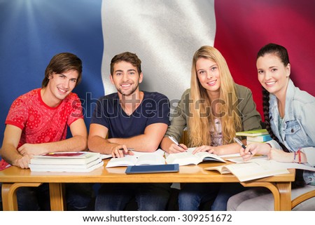 Students studying against digitally generated france national flag