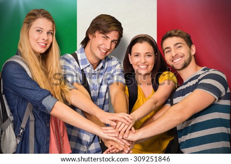 College students placing hands together against italy national flag