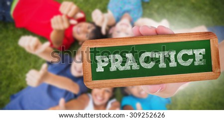The word practice and hand showing chalkboard against happy friends playing in the park