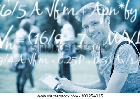 Maths equation against handsome student studying outside on campus