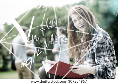 Math problems against pretty student studying outside on campus