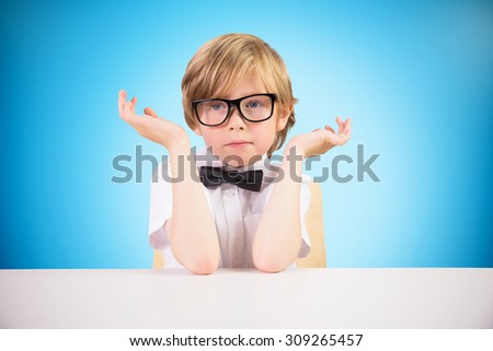 Cute pupil looking confused against blue background with vignette