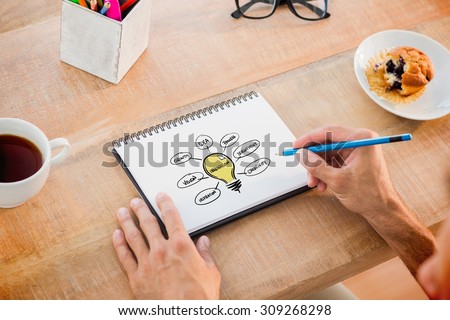 Man writing notes on notebook against innovation doodle