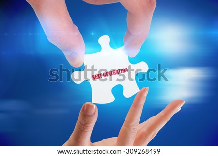 The word next generation and hands holding jigsaw against bright blue sky with clouds