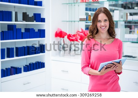 Pretty woman shopping for cosmetics at the pharmacy
