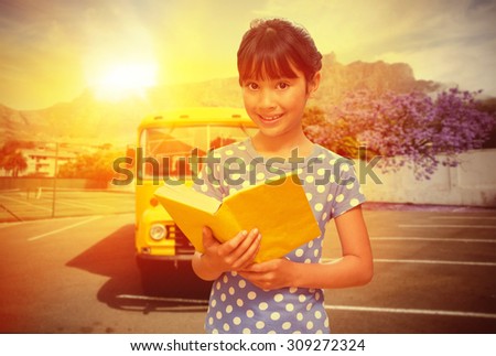 happy pupil against yellow school bus waiting for pupils