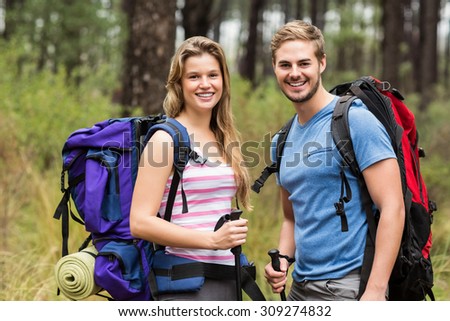Portrait of a young happy hikers couple in the nature