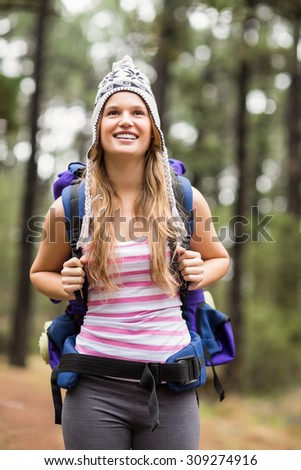 Young happy hiker looking in the distance in the nature