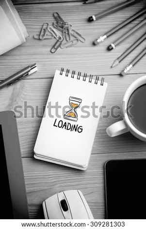 loading doodle against notepad on desk