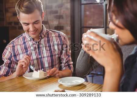 Group of friends enjoying a breakfast in a cafe