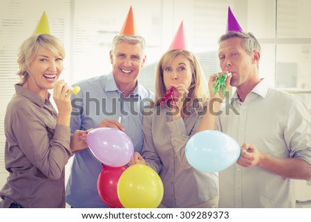 Portrait of casual business people celebrating birthday in the office