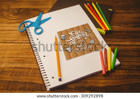 Notepad on student desk against old school vs new school