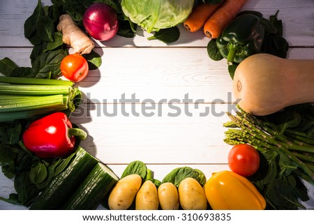 Circle of vegetables on table shot in studio