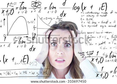 Stressed businesswoman with hands on her head against maths equation