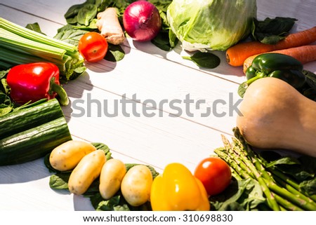 Circle of vegetables on table shot in studio