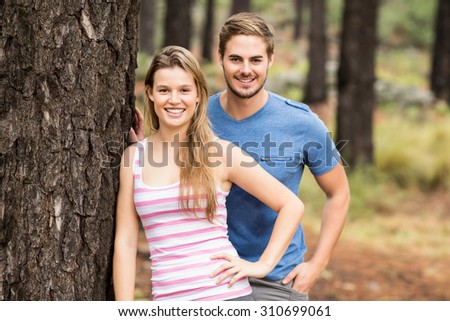 Portrait of a young happy hiker couple in the nature
