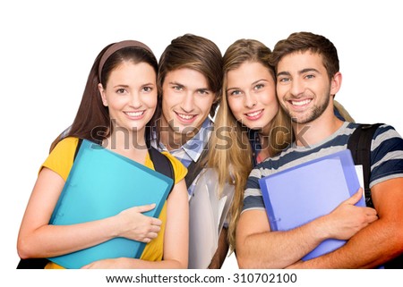 Happy students holding folders at college corridor against white background with vignette