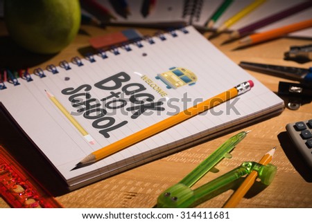 back to school against students table with school supplies