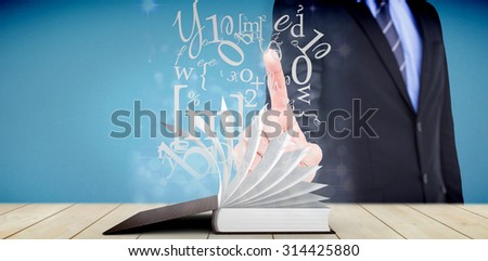 Mid section of businessman pointing something up against light design shimmering on silver