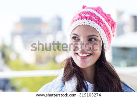 Beautiful woman wearing woolly hat outside