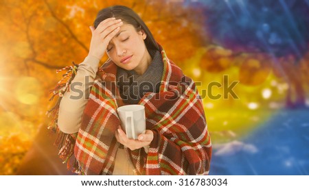 Sick woman having a migraine against autumn changing to winter