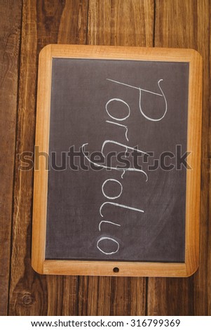 Chalkboard on table with portfolio text shot in studio