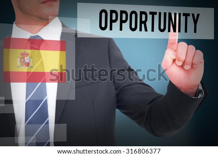 The word opportunity and businessman in suit pointing his finger against blue background