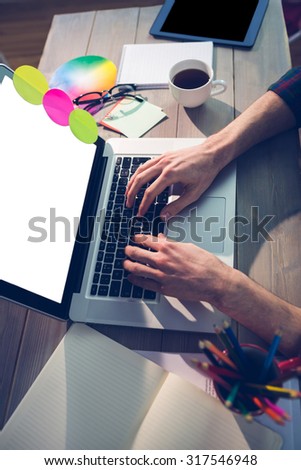 Cropped image of creative graphic designer using laptop in office