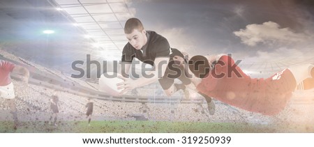 A rugby player scoring a try against rugby match