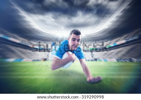 A rugby player scoring a try against rugby stadium
