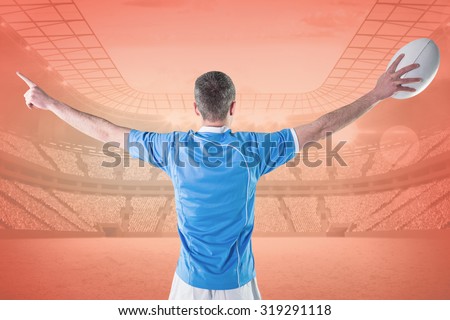 Rugby player about to throw a rugby ball against orange
