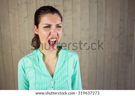 Screaming woman suffering from headache at home