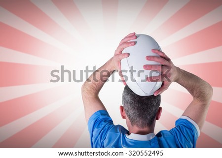 Rugby player about to throw a rugby ball against linear design