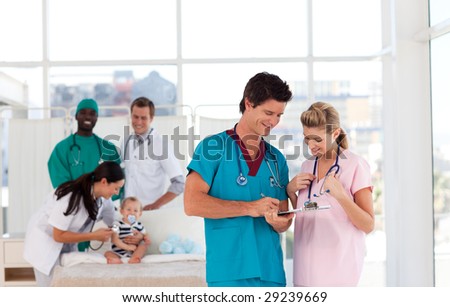 Group of Doctors in a hospital looking after a patient