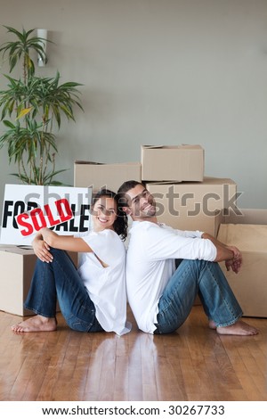 Young Couple relaxing after buying house