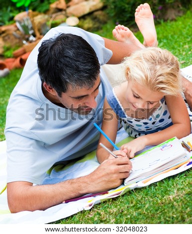 Dad and daughter painting together in a garden