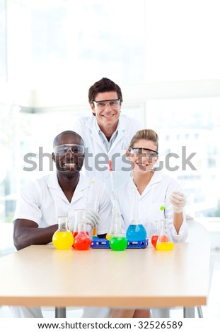 Attractive Science students examining test-tubes in university