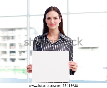 Attractive businesswoman holding a business card