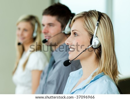 Businesspeople working with headsets in an office