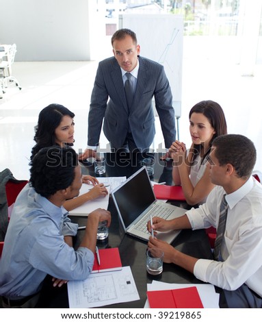 Business people studying a new business plan in office