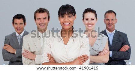 Multi-ethnic business team with folded arms in the office