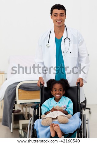 Doctor helping a young child in a hospital