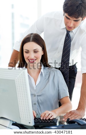 Businessman helping his colleague in the office