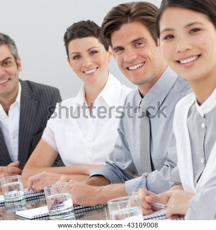 International business people sitting around a conference table. Business concept.
