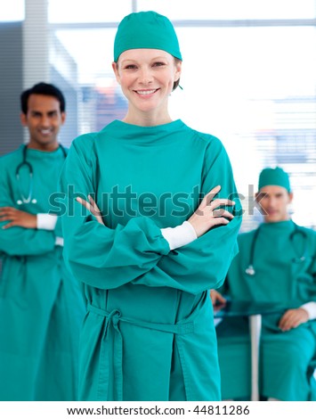 Confident surgeons smiling at the camera in a hospital