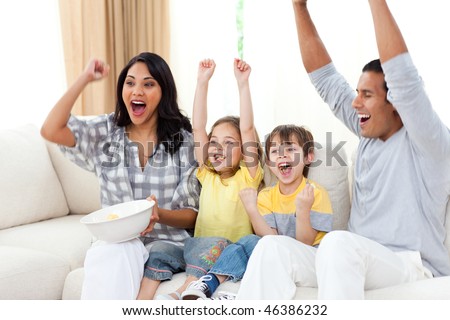 Animated family watching TV on sofa in the living room