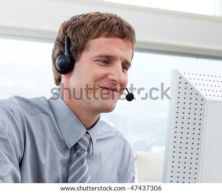 Close-up of businessman working in a call center in a company