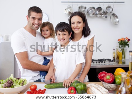 Smiling family cooking together in the kitchen